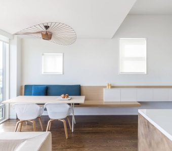 White and wood chairs with a feature light